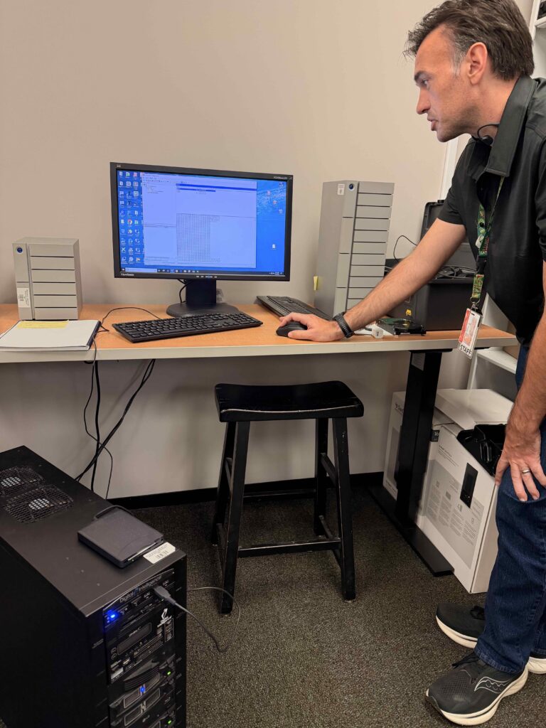 Archivist Brian Thomas uses a computer named FRED, which stands for Forensic Recovery of Evidence Device
