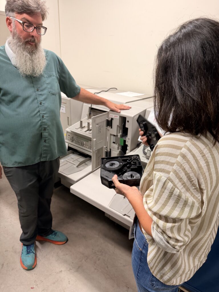 Record Center Manager Zach Bruton and Imaging Supervisor Jacqueline Jacobs explain the mircofilm copy machines